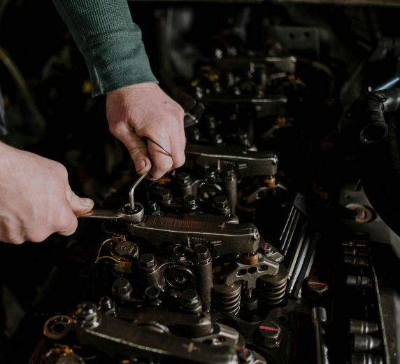 car repair - technician working on part of the car 